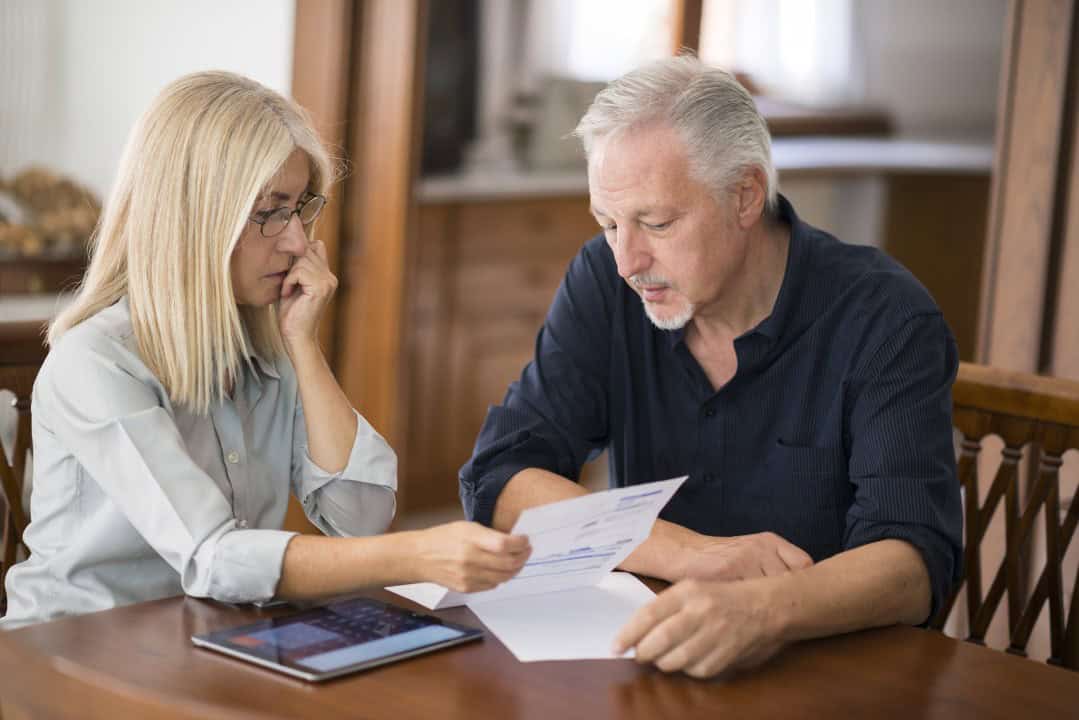 Couple calculating their expenses together