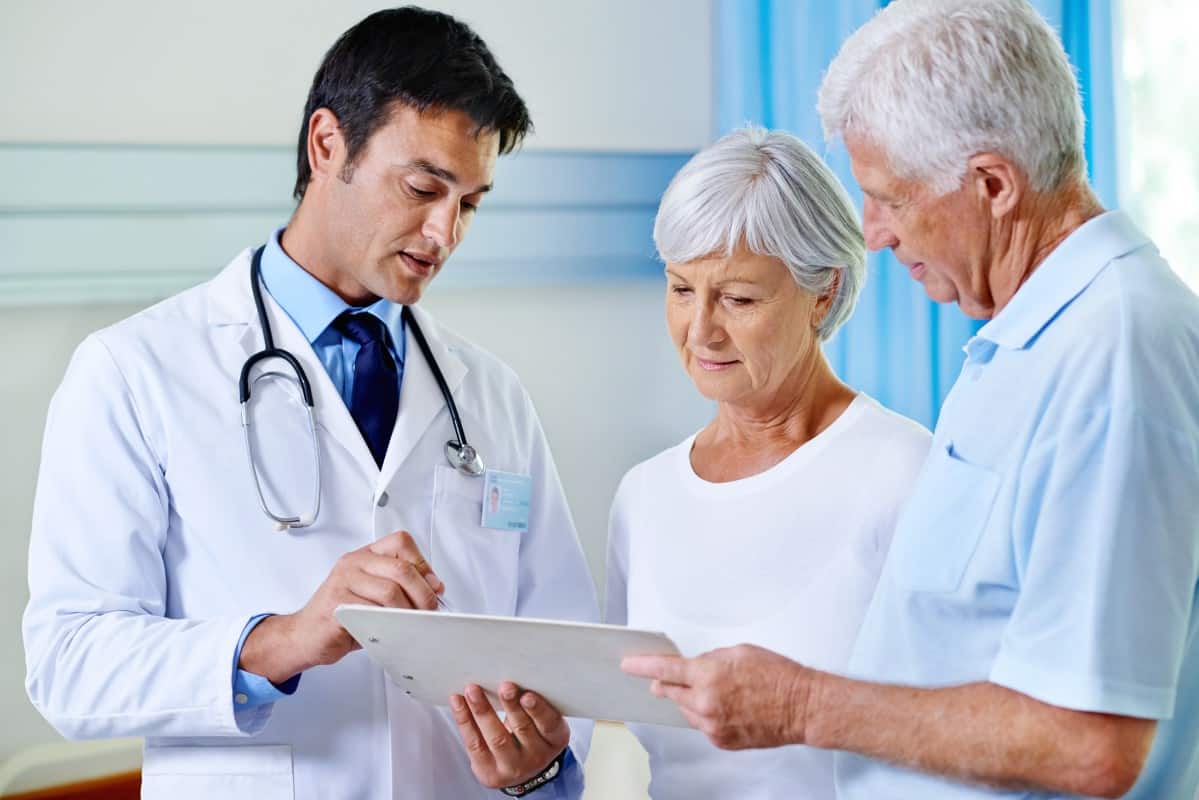 Doctor with older couple