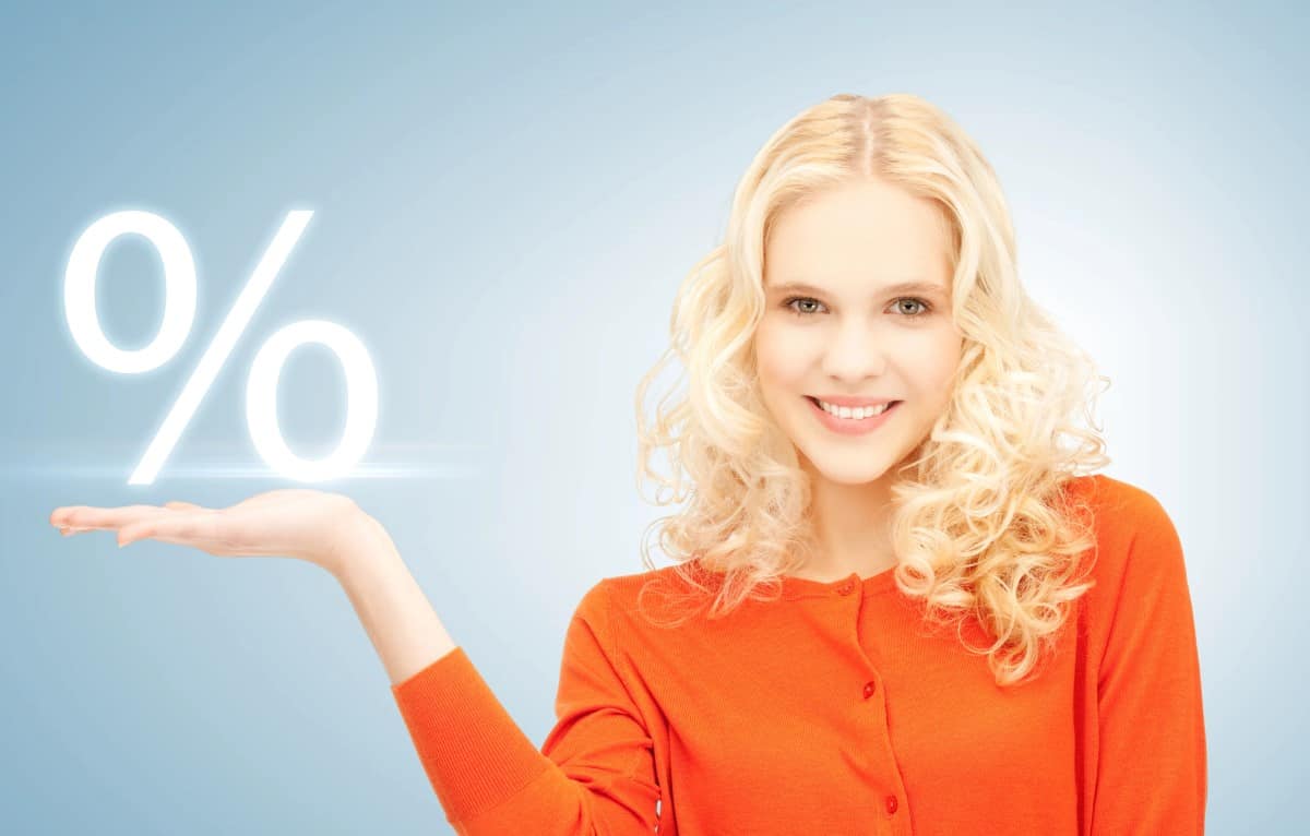 Girl showing sign of percent in her hand