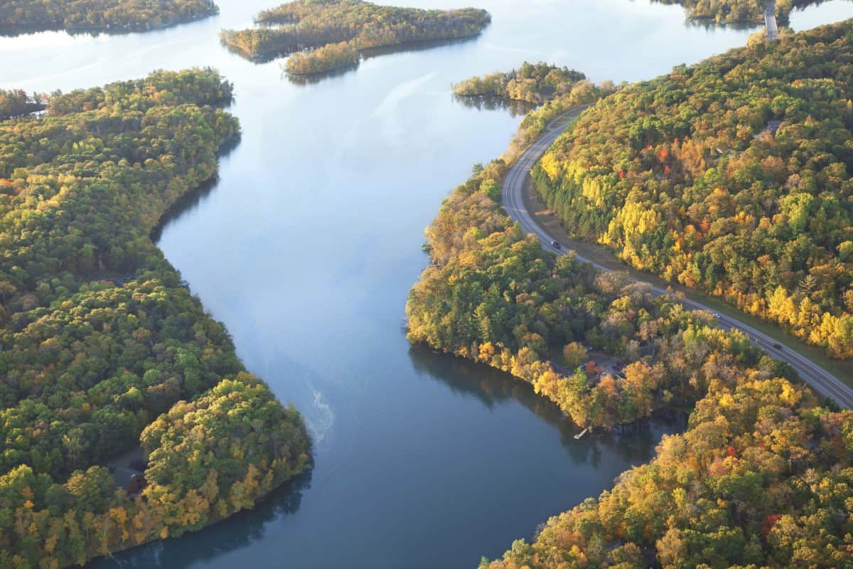 Curving road along Mississippi River during autumn 