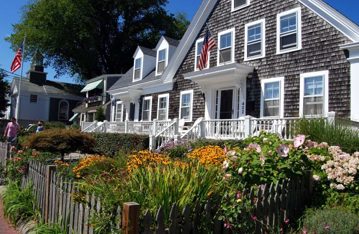 PROVINCETOWN, MASSACHUSETTS:   A handsome Cape Cod shingled home with white trimmed windows and two upstairs dormers