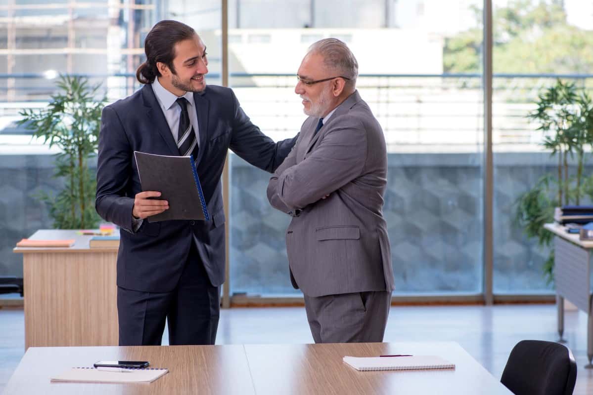 Young boss and older employee Business meeting 