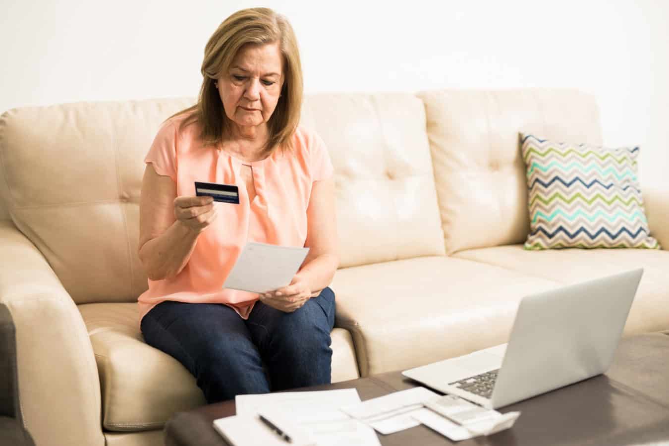 Worried woman with credit card