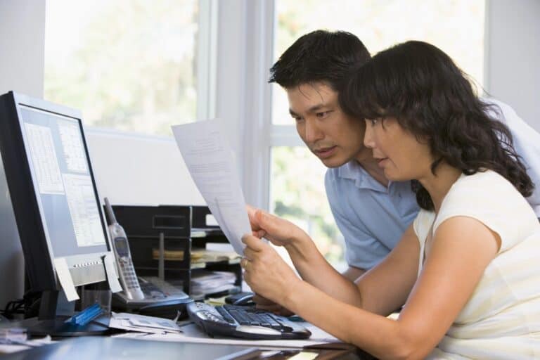 Worried couple checking their finances