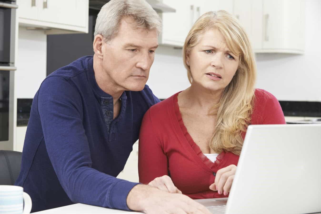 Worried Couple Reviewing Domestic Finances