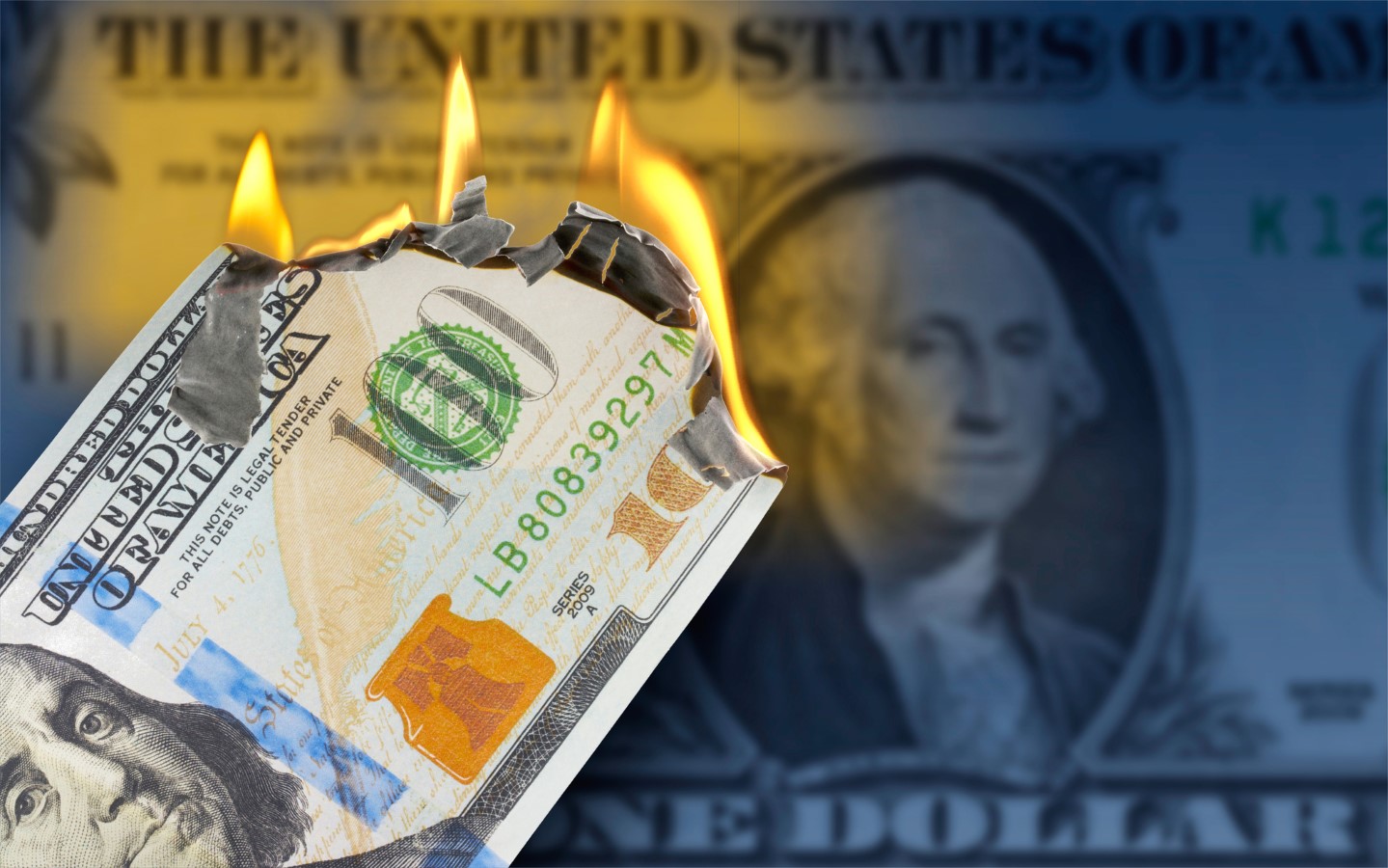 A burning 100 US dollar bill