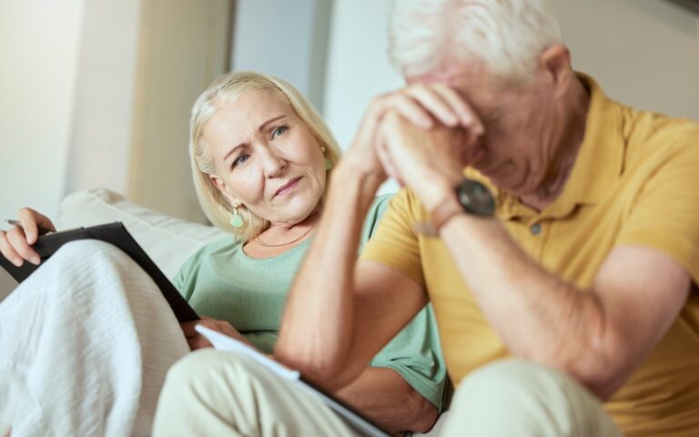 Worried older couple