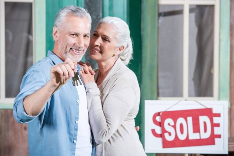 Senior couple with new house keys