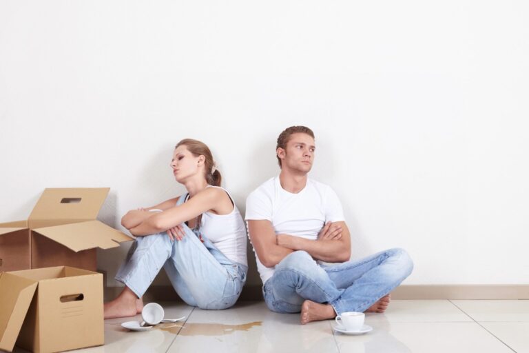 Young couple on the background of a row of broken plate