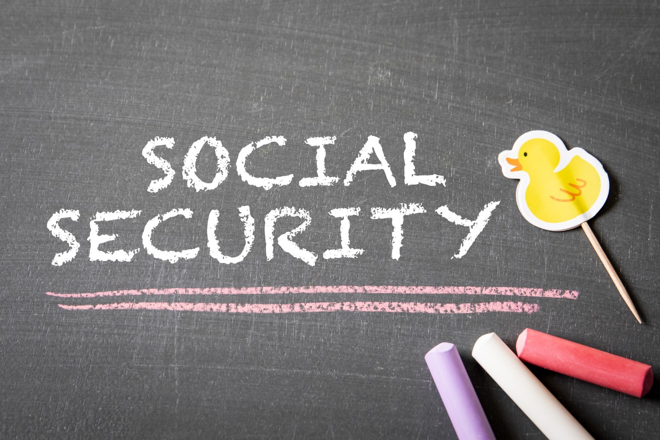Seniors Fear 2026 COLA Won’t Match Inflation And Now the Data Can’t Be Trusted 1 SOCIAL SECURITY Concept. Text and colored pieces of chalk on a dark chalkboard