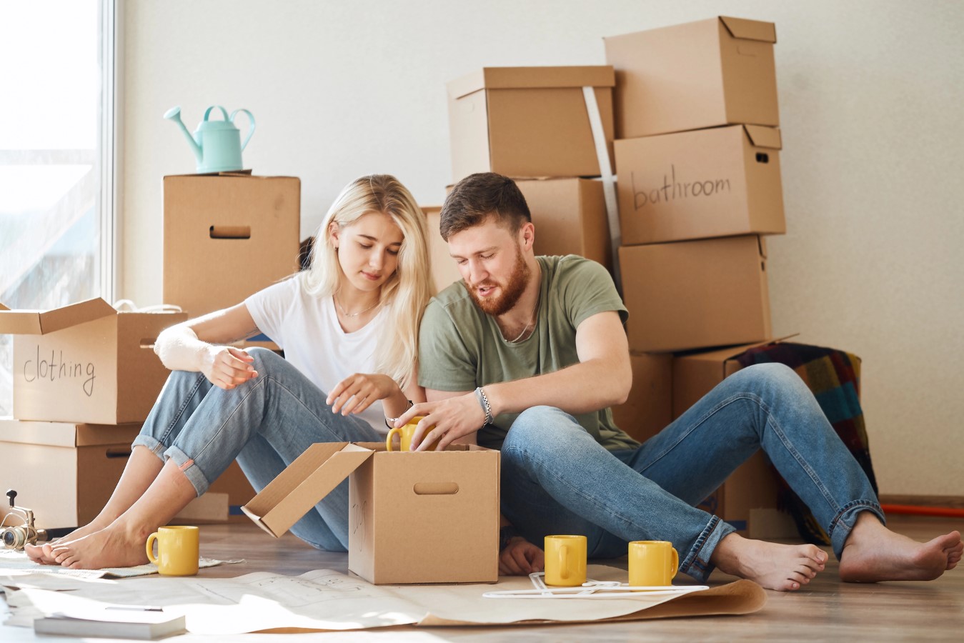 The $1 Million ‘Starter Home’ Is Now Reality in 233 Cities. Has the American Dream Collapsed? 1 Couple in new apartment unpacking cardboard boxes after moving