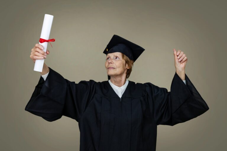 Senior woman graduate in graduation gown and cap