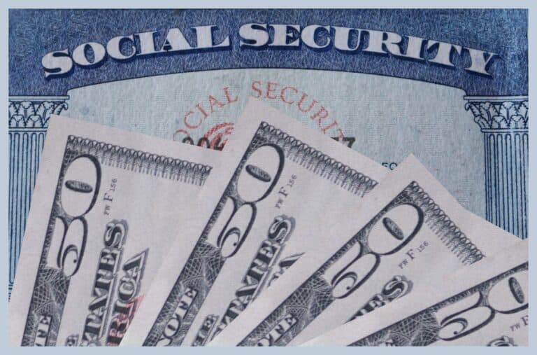 Social security card with a display of fifty dollar bills