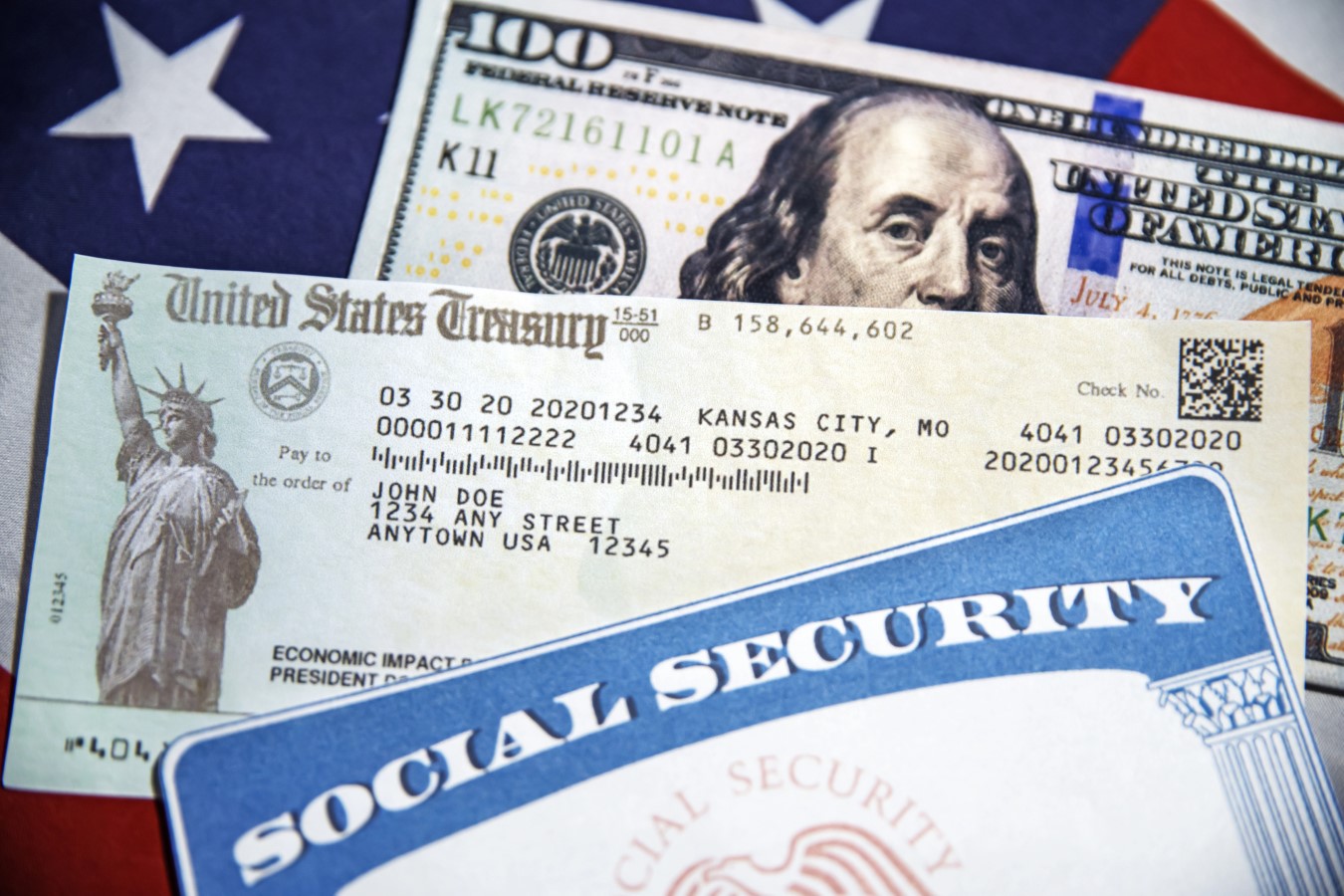 U.S. Treasury check, SSN and American dollar bill with flag