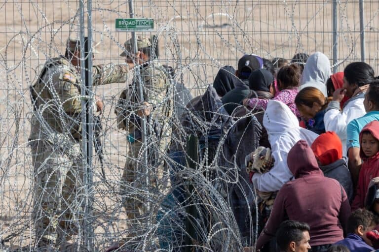 Migrants camp along the Rio Grande border
