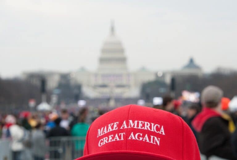A Trump MAGA hat with the U.S. Capitol background