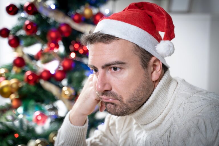 One worried man suffering Christmas stress and anxiety