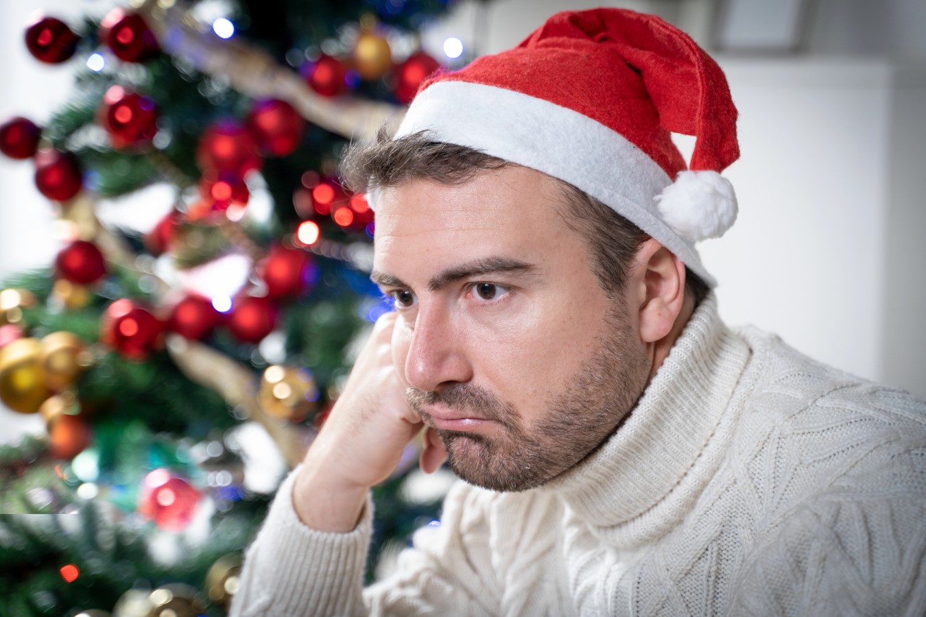 One worried man suffering Christmas stress and anxiety