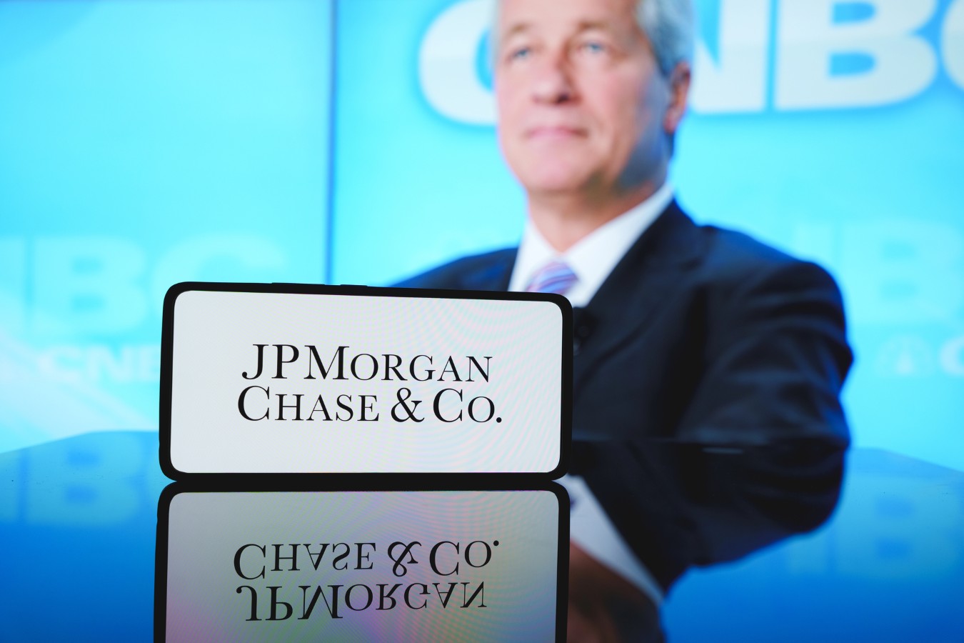 JPMorgan Chase logo in front of company CEO Jamie Dimon